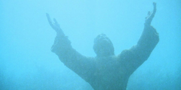 submerged jesus statue